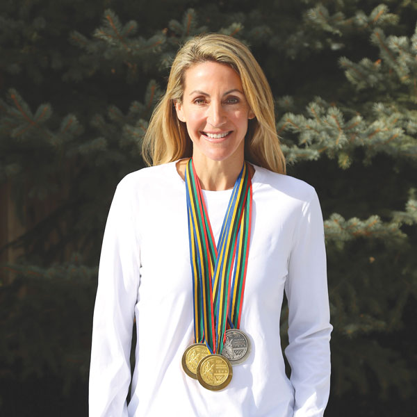 Olympic swimmer Summer Sanders wearing her medals