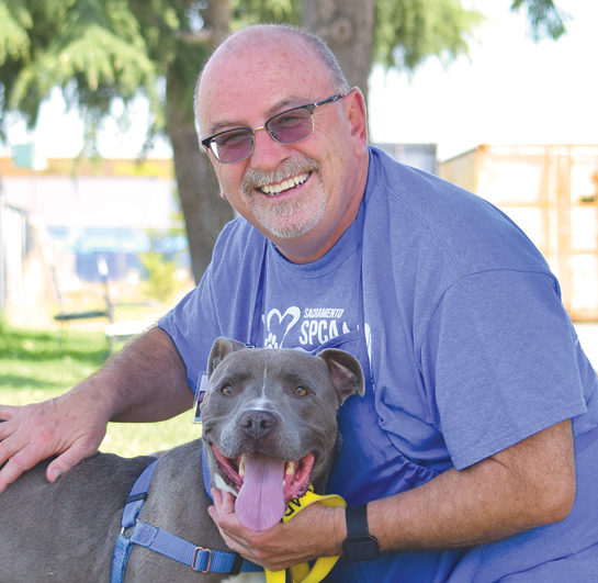 Former Raley's executive Nereo Rebellato with american pit bull terrier porky