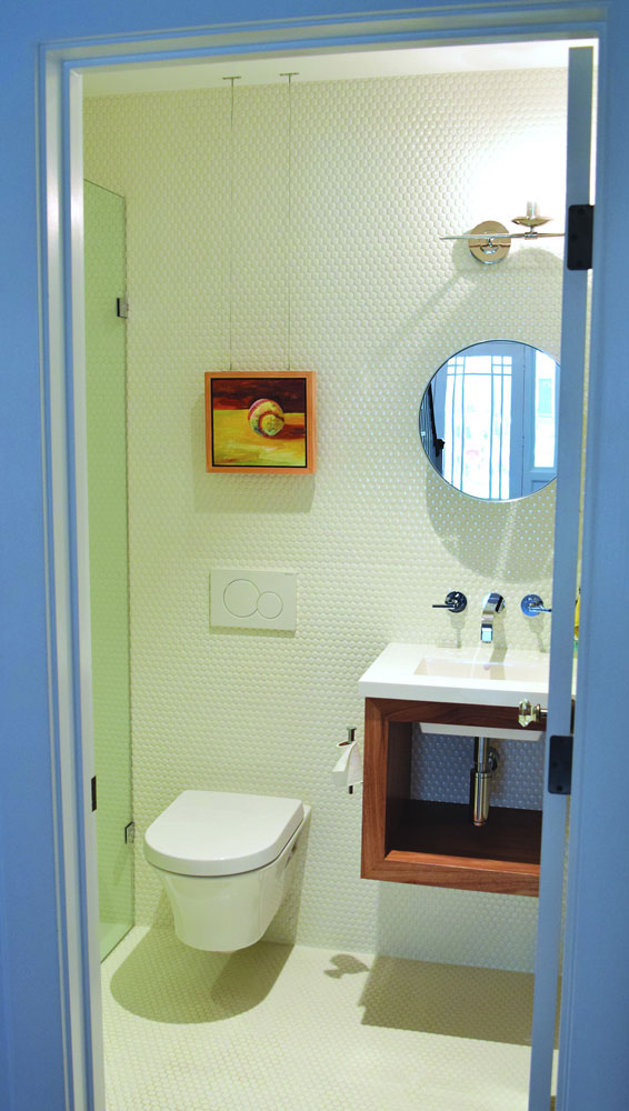 small guest bathroom with hexagonal tiles