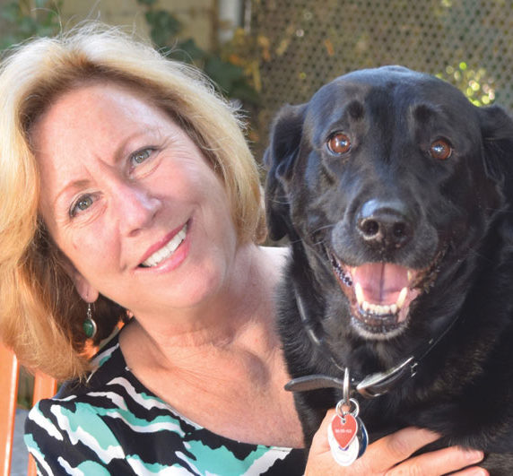 Former Shelter Leader Gina Kepp with her rescue lab Coal