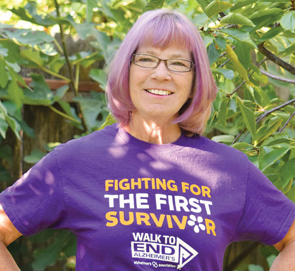 Volunteer Lynette Blumhardt posing in Walk To End Alzheimers shirt